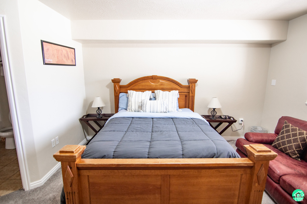 Carpeted bedroom with baseboards