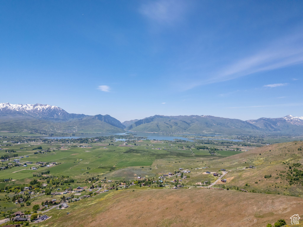 Mountain view featuring a nearby body of water