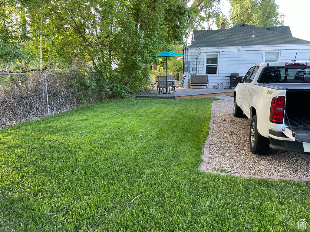 View of yard with a deck and a patio area