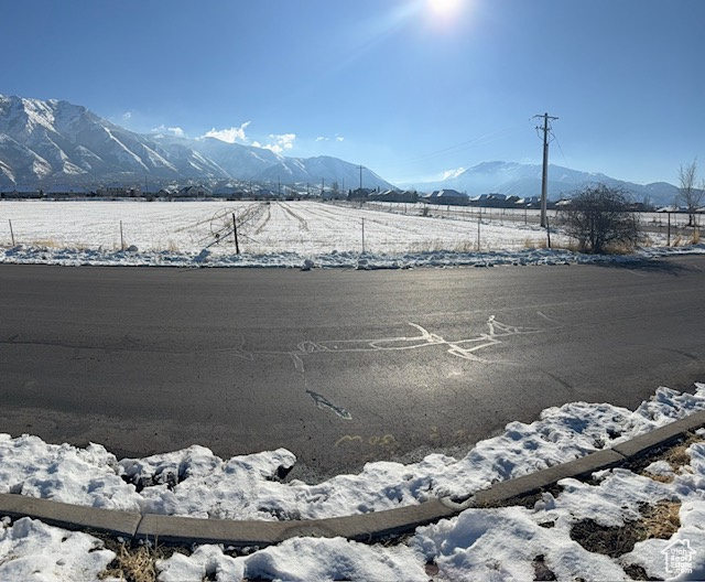 Property view of mountains with a rural view