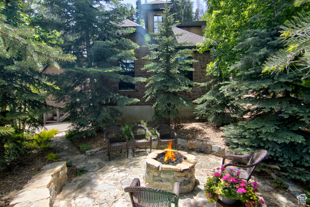 View of patio / terrace with an outdoor fire pit