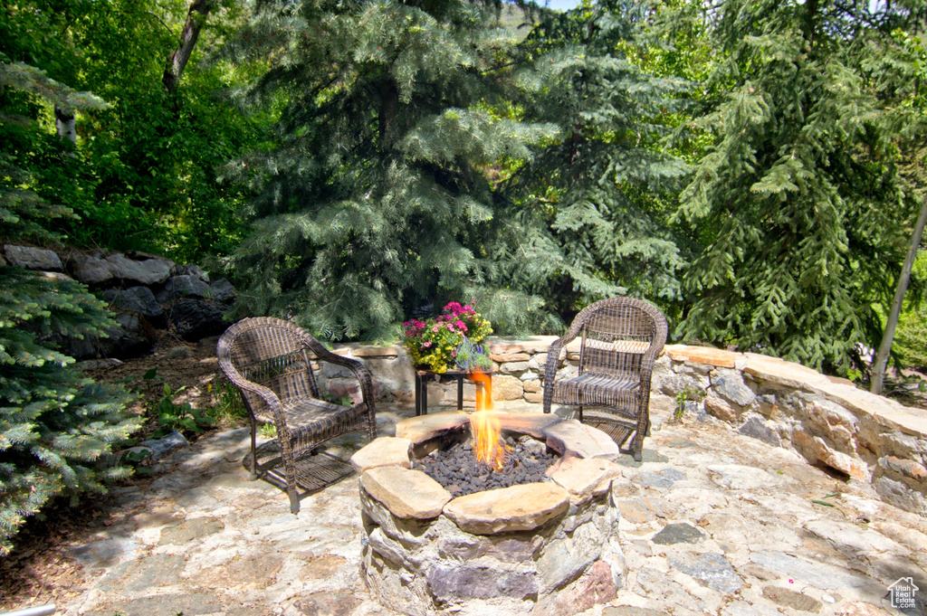View of patio / terrace with an outdoor fire pit