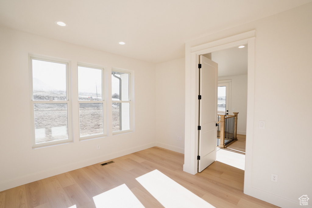 Empty room with light wood-type flooring