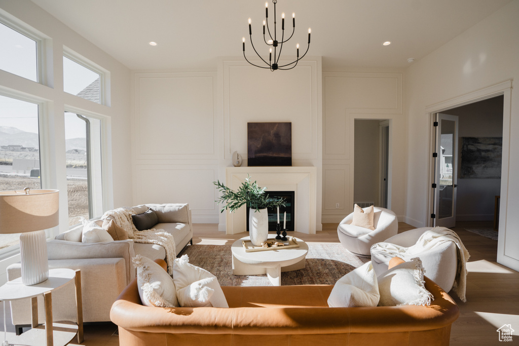 Living room featuring hardwood / wood-style flooring and an inviting chandelier