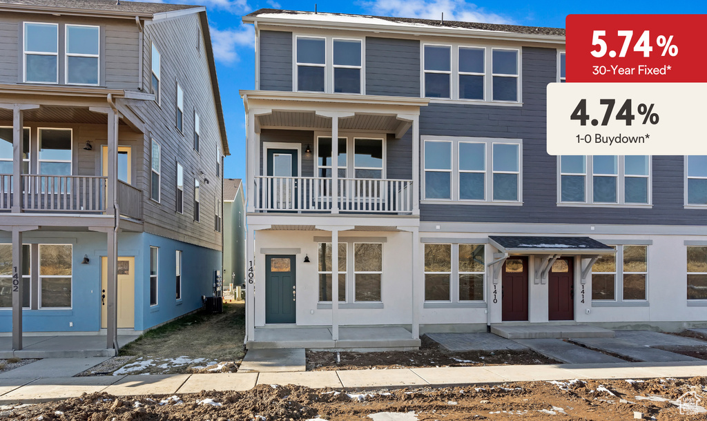 View of front of house featuring a balcony