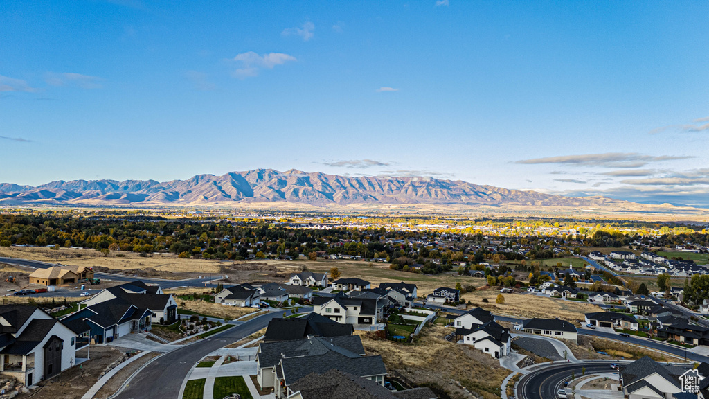 Birds eye view of property with a mountain view