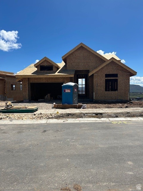 View of front of property featuring a garage