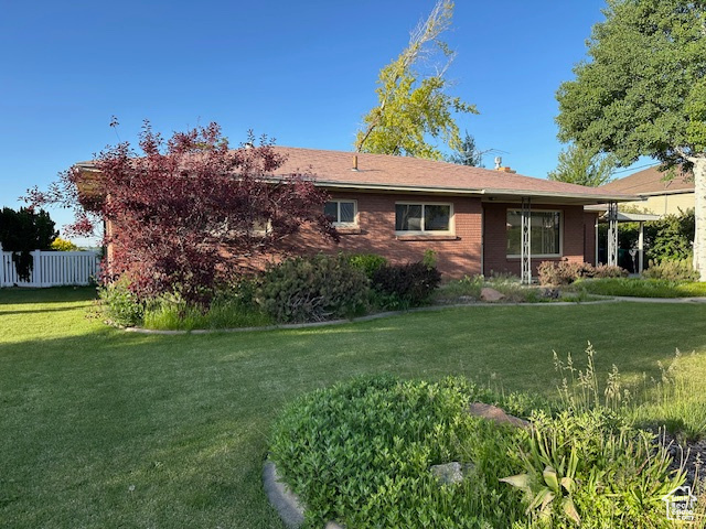 View of home\'s exterior featuring brick siding