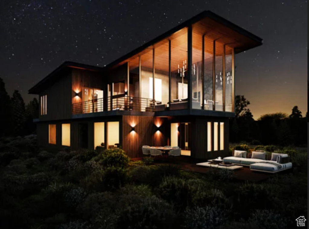 View of back of house at twilight