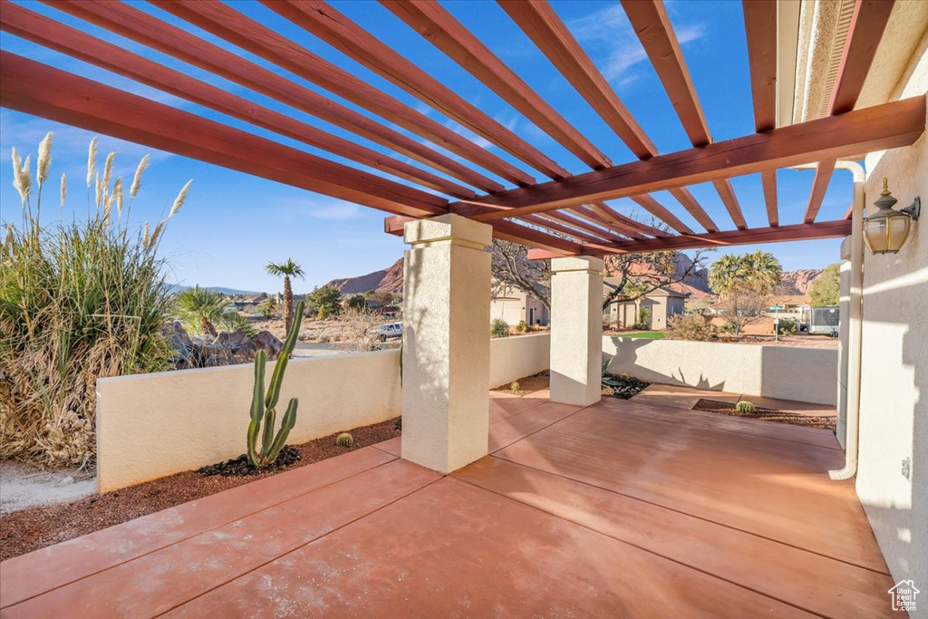 View of patio / terrace featuring a pergola and a mountain view