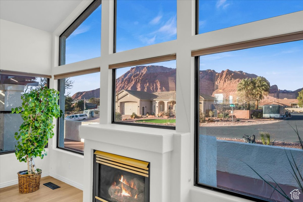 Room details with a mountain view and hardwood / wood-style flooring