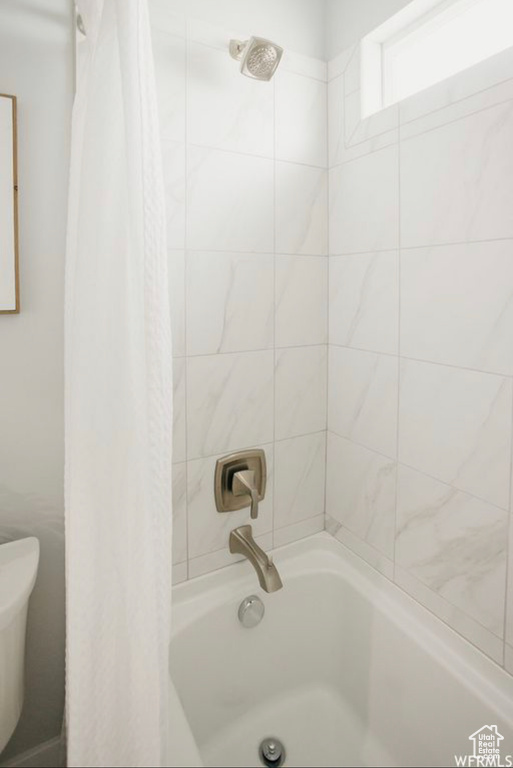 Bathroom with shower / bath combo and toilet