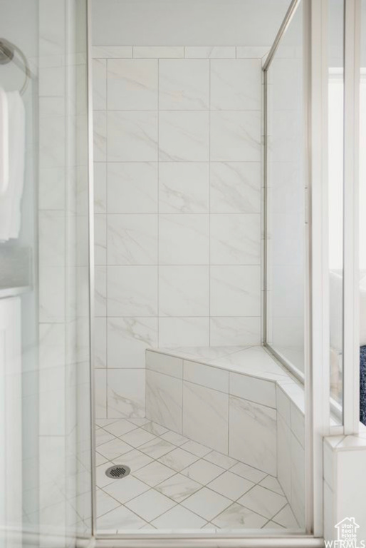 Bathroom with a shower with door