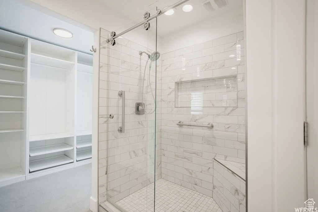 Bathroom with a shower with shower door