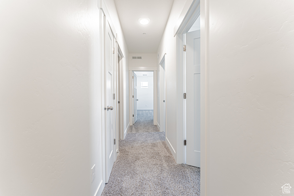Corridor featuring baseboards
