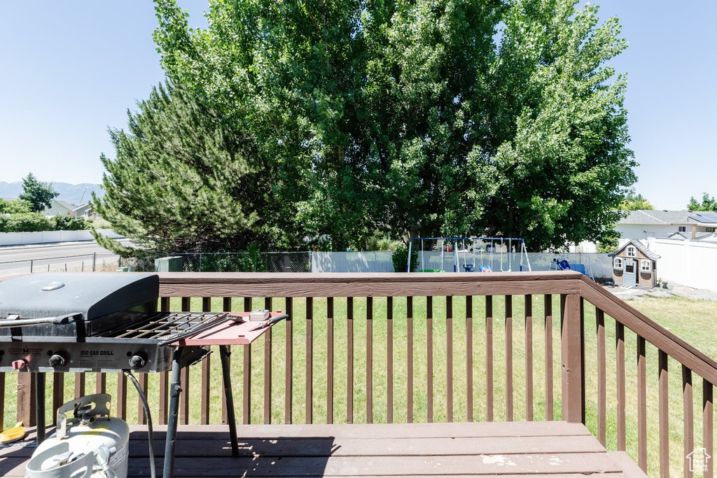 Wooden deck featuring a yard