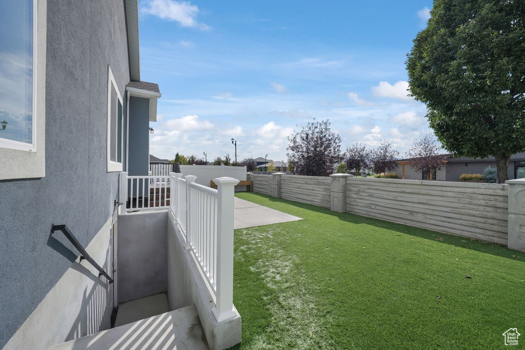 View of yard with a patio area