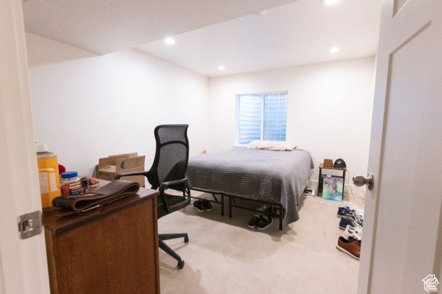 Bedroom with light carpet