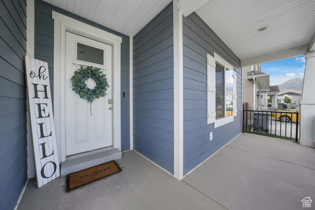 Property entrance with covered porch