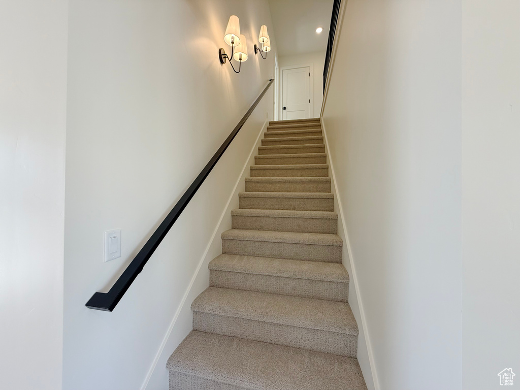 Stairs featuring baseboards, recessed lighting, and carpet floors