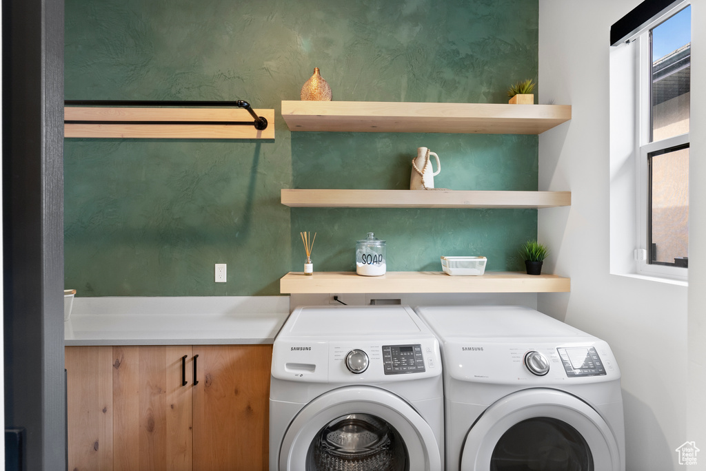 Laundry area featuring separate washer and dryer