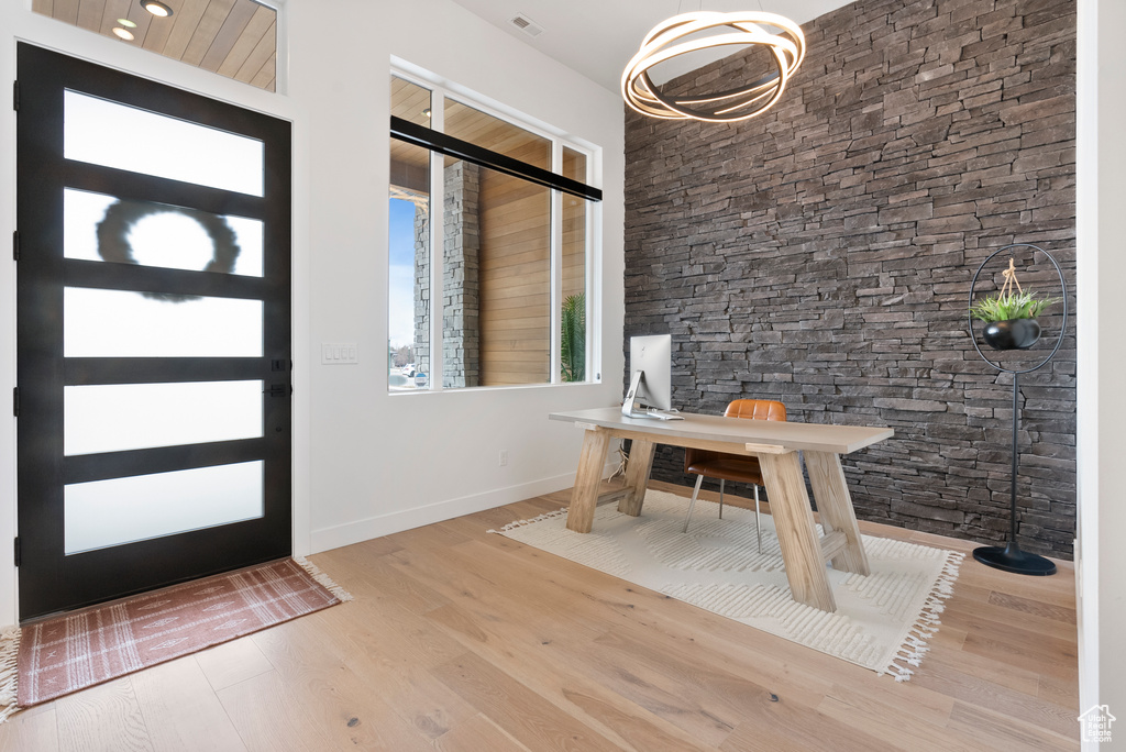 Foyer entrance with hardwood / wood-style flooring