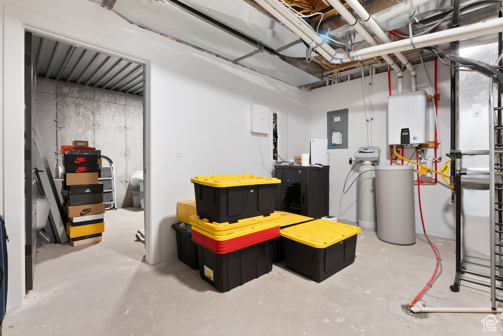 Basement with electric panel and water heater