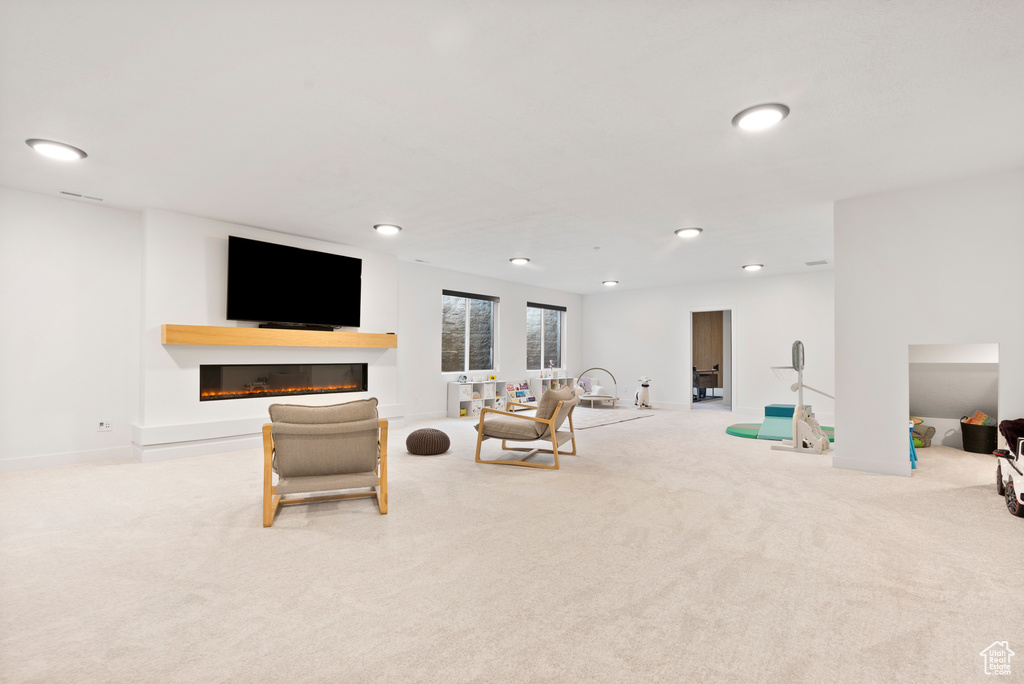 Living room featuring light colored carpet