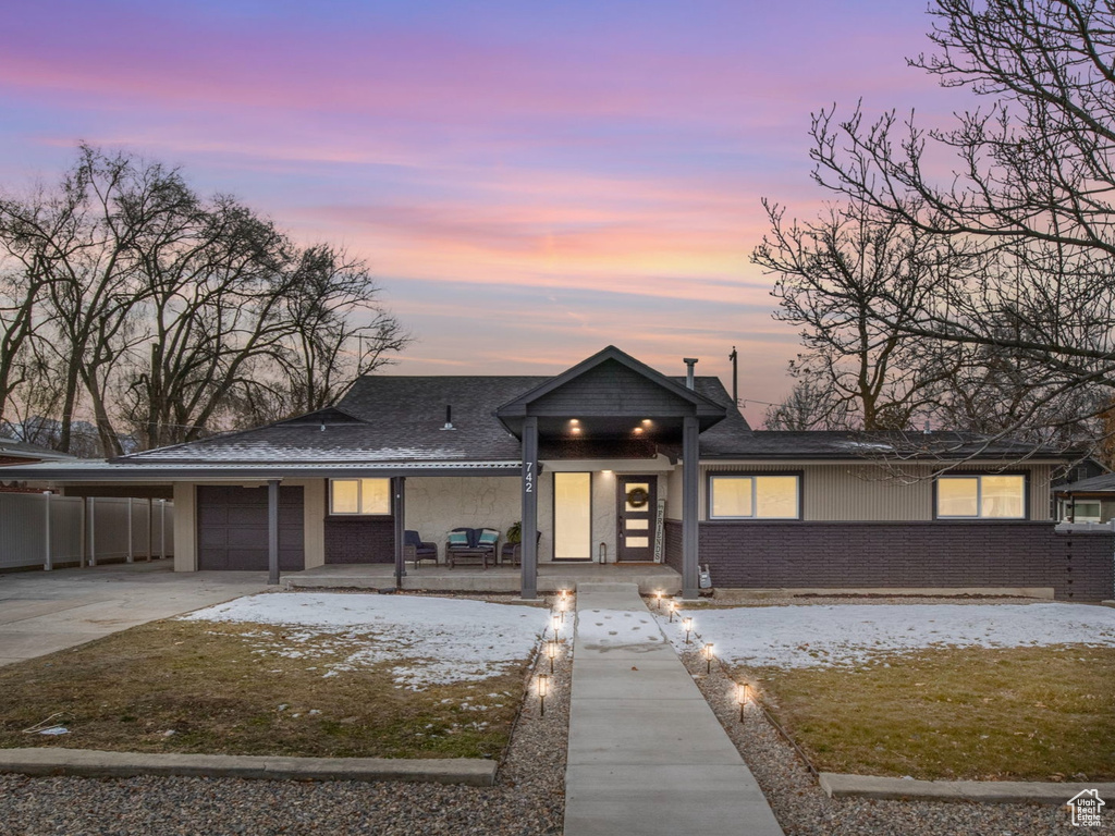 View of front of property with a carport