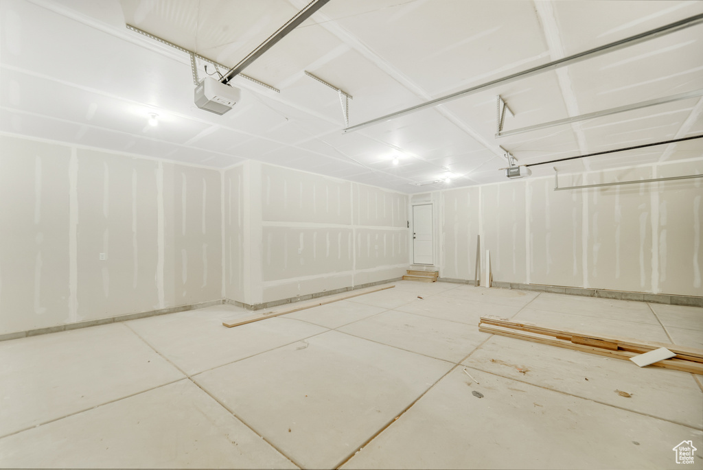 Garage featuring a garage door opener