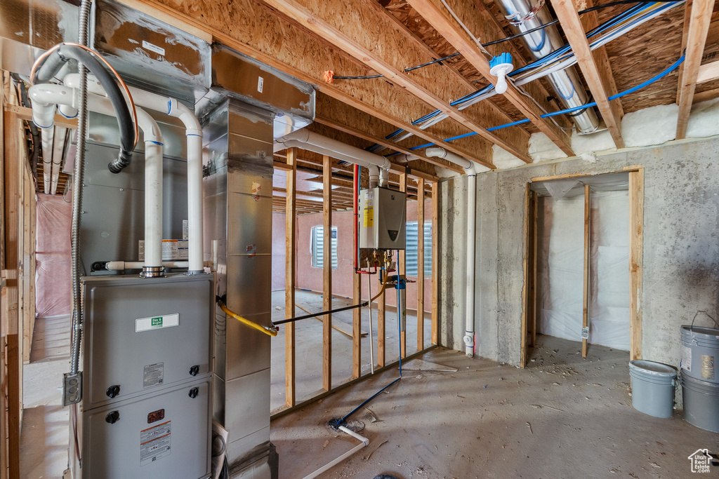 Basement featuring tankless water heater