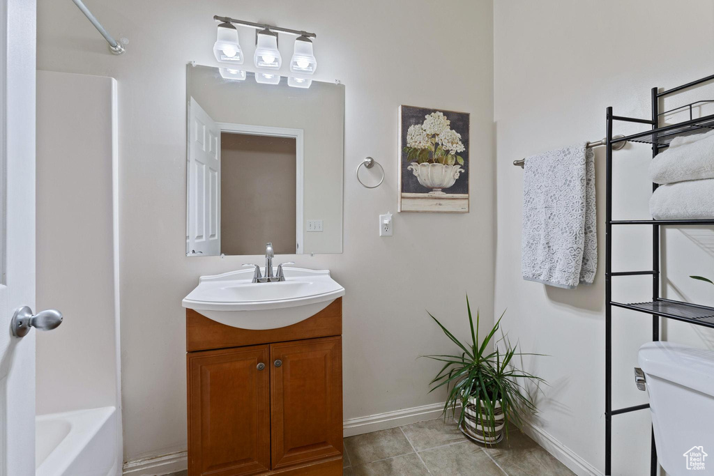 Full bathroom featuring tile patterned floors, vanity, bathing tub / shower combination, and toilet