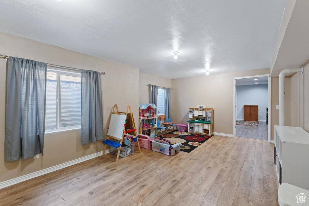 Playroom featuring light hardwood / wood-style flooring and a healthy amount of sunlight