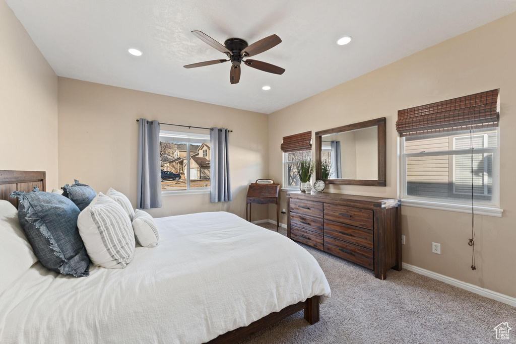 Bedroom featuring light carpet and ceiling fan