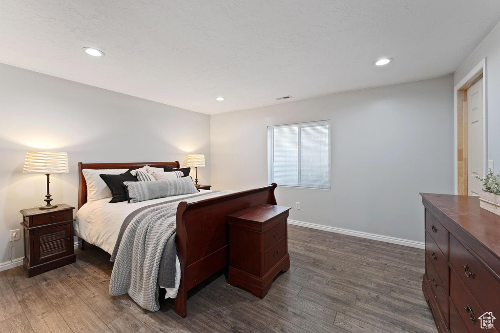 Bedroom featuring dark wood-type flooring