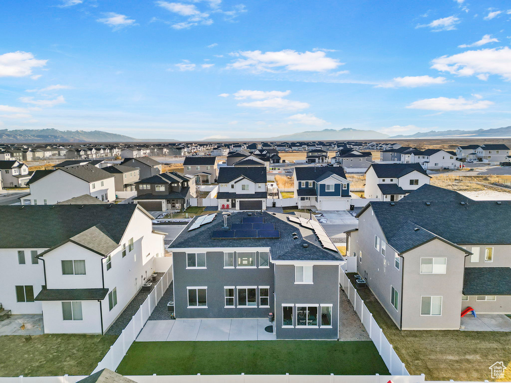 Birds eye view of property with a mountain view