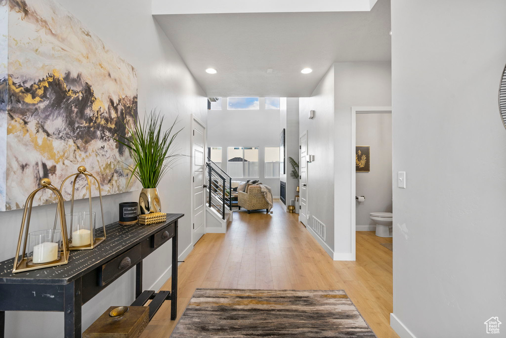 Corridor with light hardwood / wood-style floors