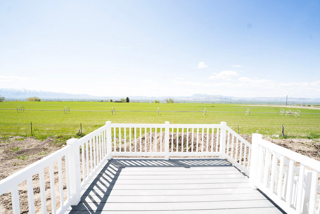 Wooden deck featuring a view of rural / pastoral area and a mountain view