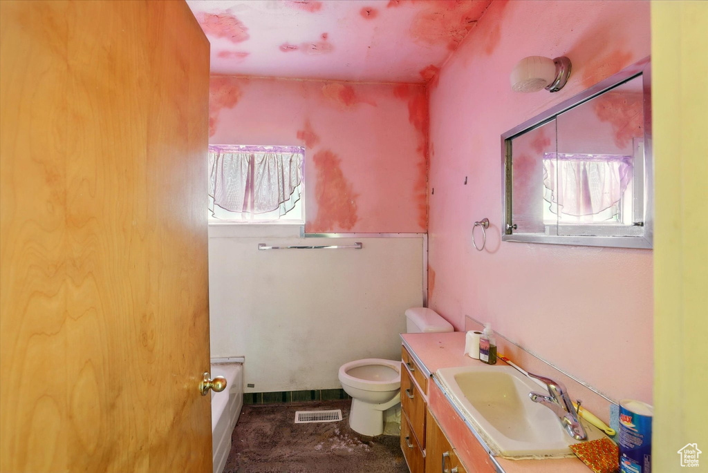 Bathroom with toilet and vanity