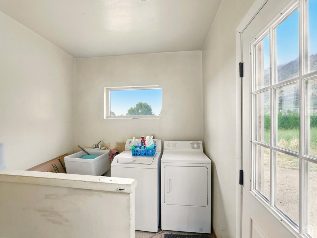 Laundry area featuring independent washer and dryer