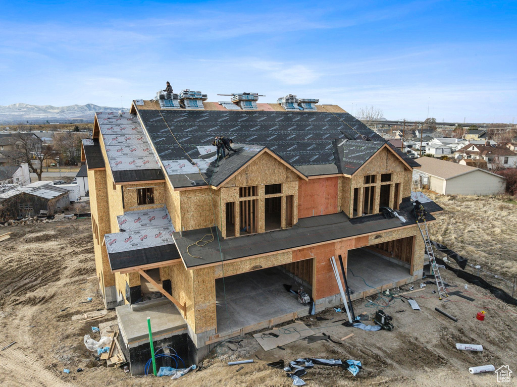Rear view of property featuring a mountain view