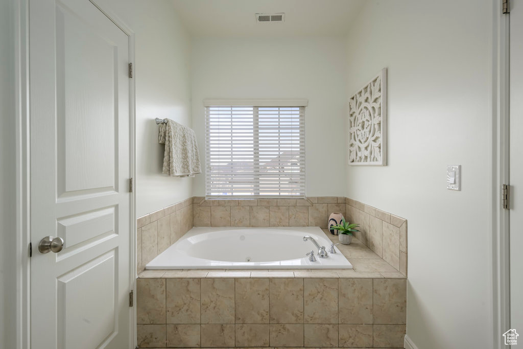 Bathroom with a relaxing tiled tub