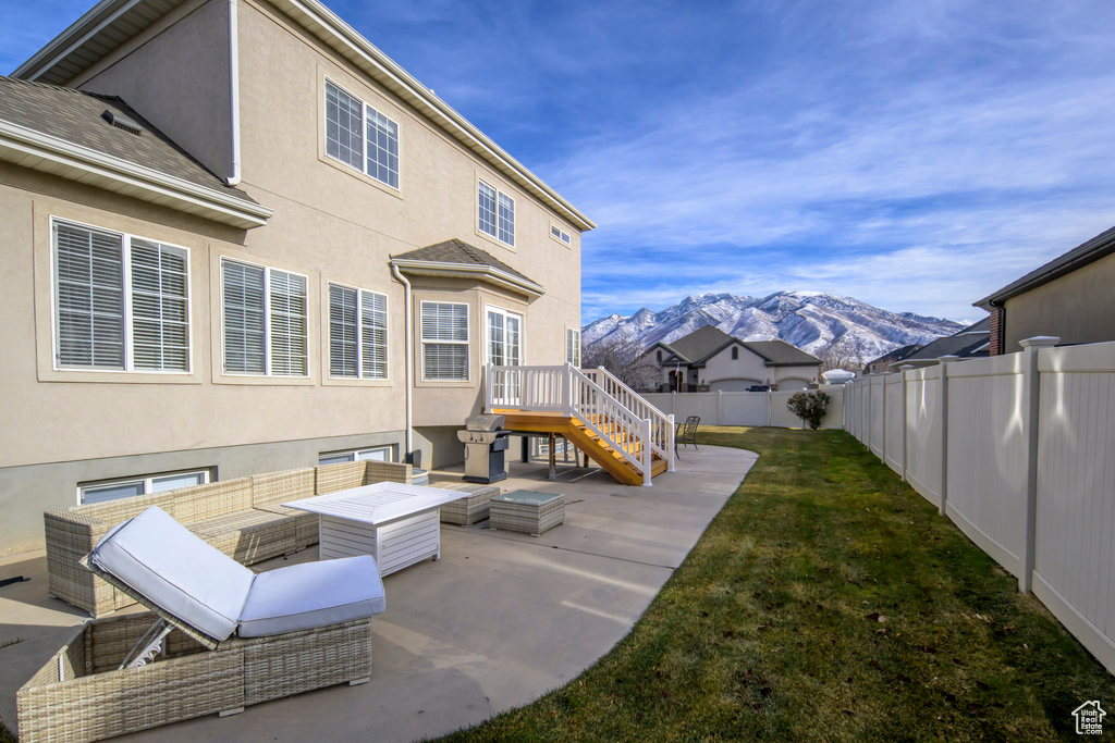 View of patio / terrace featuring a mountain view and an outdoor living space
