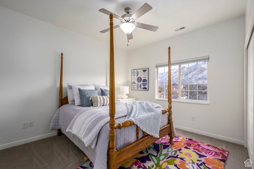 Bedroom featuring carpet floors and ceiling fan