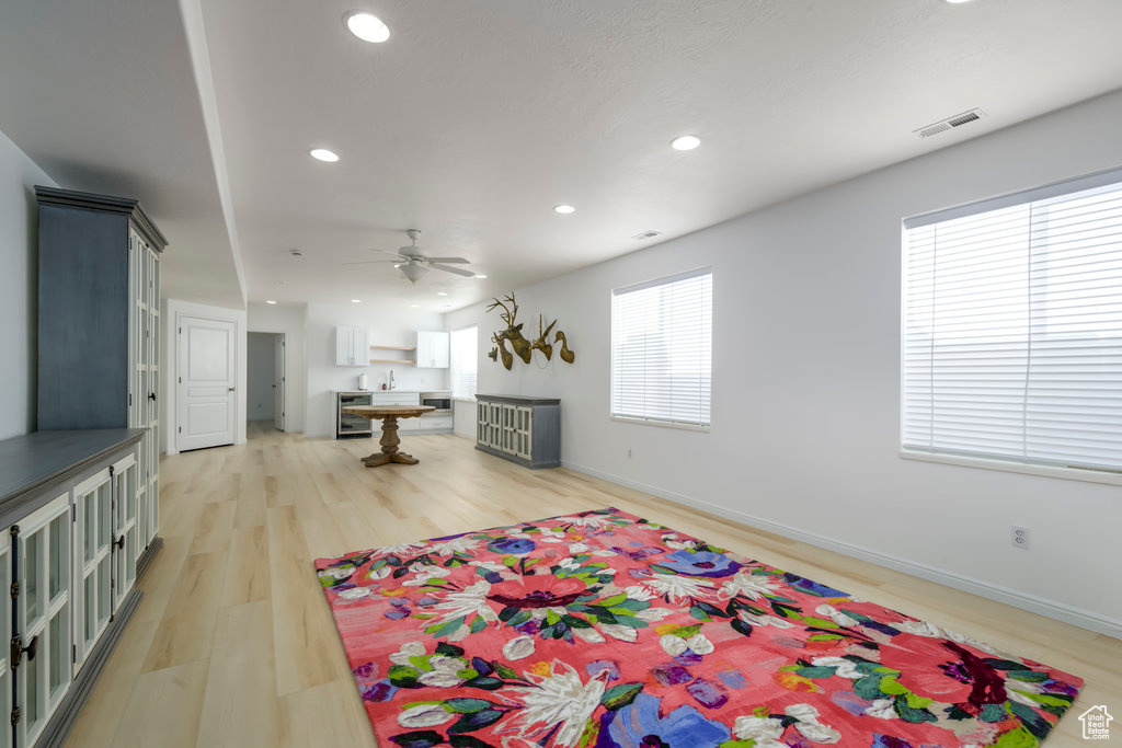Interior space featuring ceiling fan and light hardwood / wood-style floors