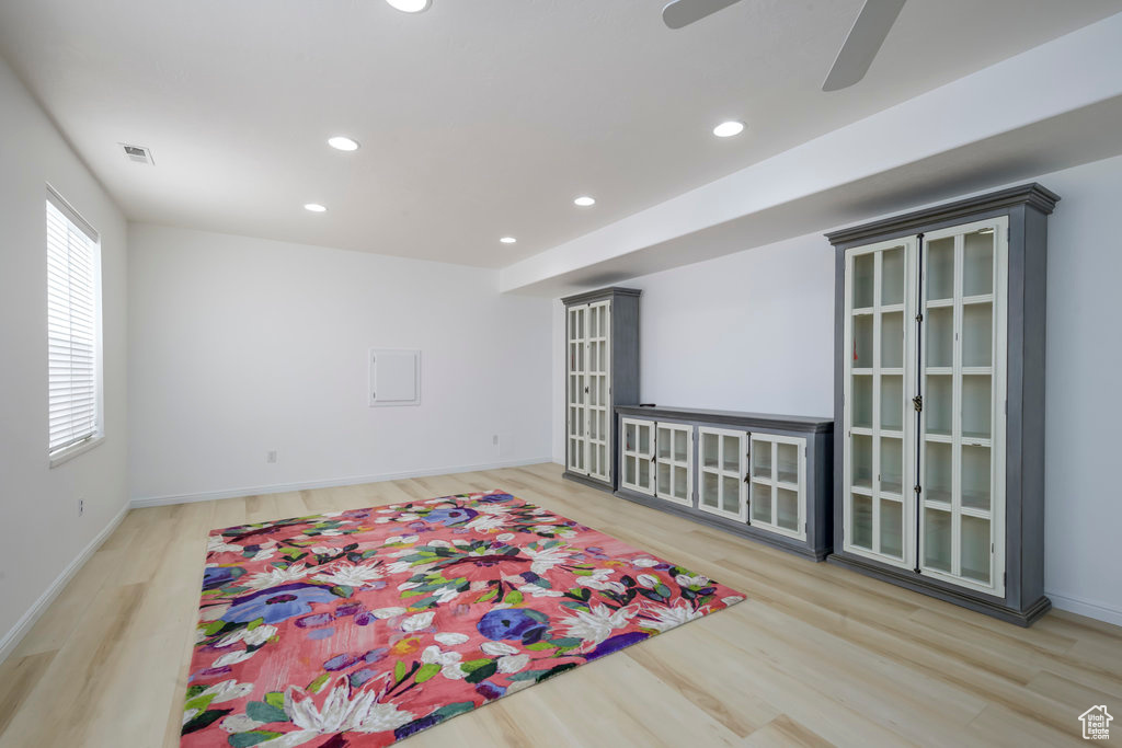 Interior space featuring wood-type flooring and ceiling fan