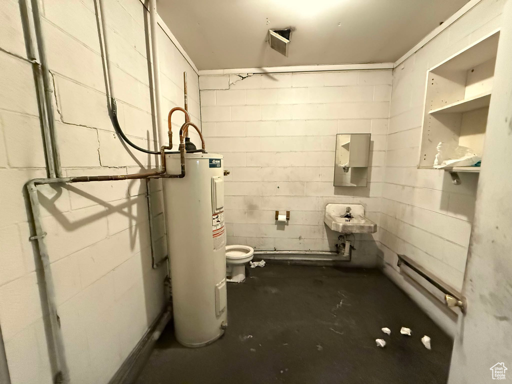 Interior space with water heater and sink