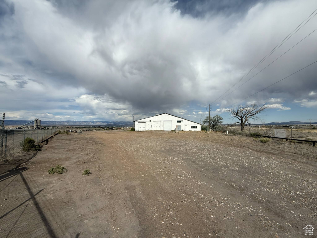 View of yard featuring a detached garage