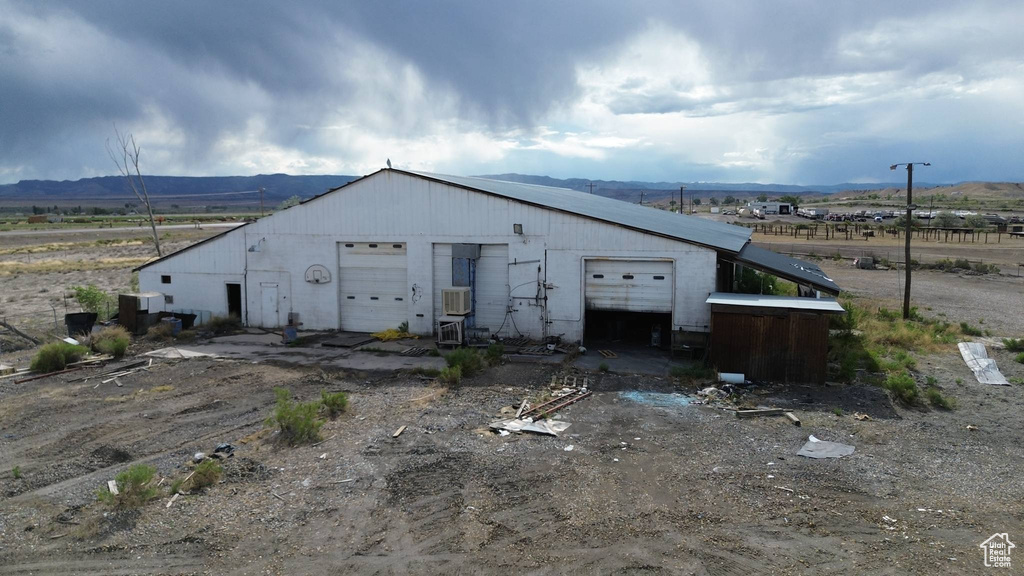 View of outbuilding with a mountain view