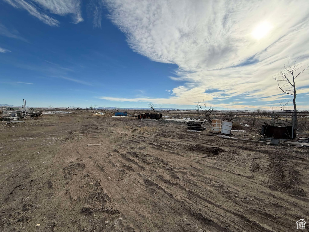 View of yard with a rural view